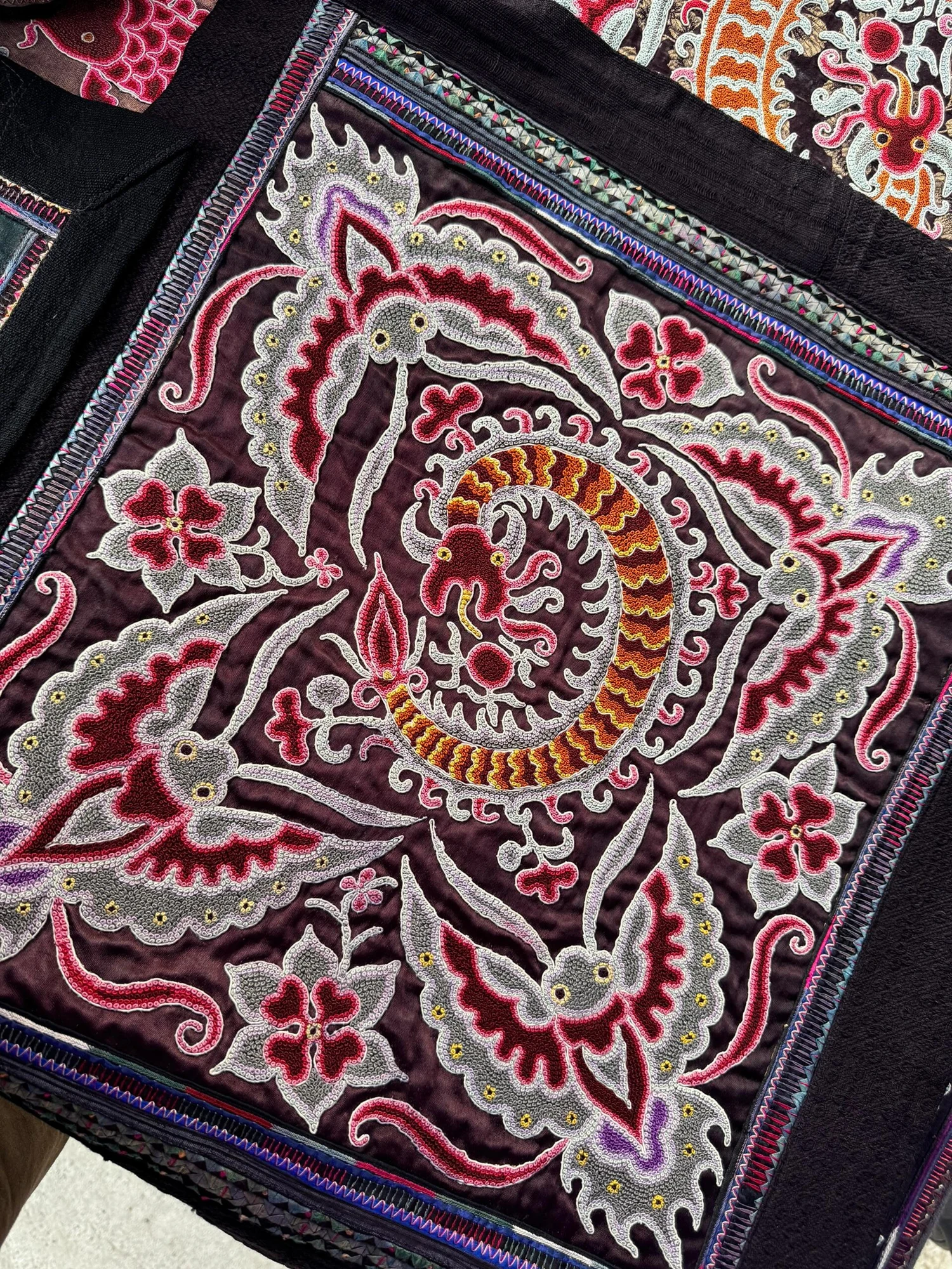 Full butterfly motif composition in Miao textile embroidery