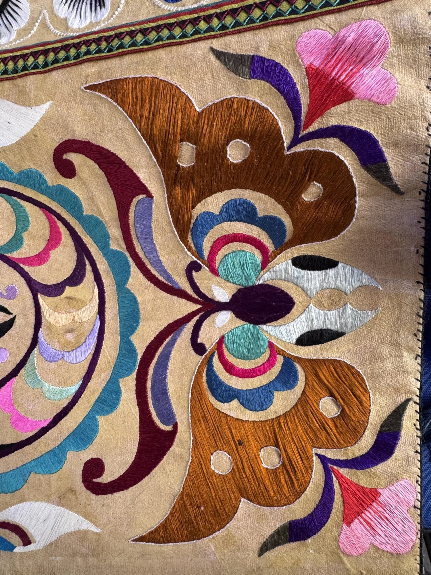 Close-up of butterfly stitch detail in Miao embroidery
