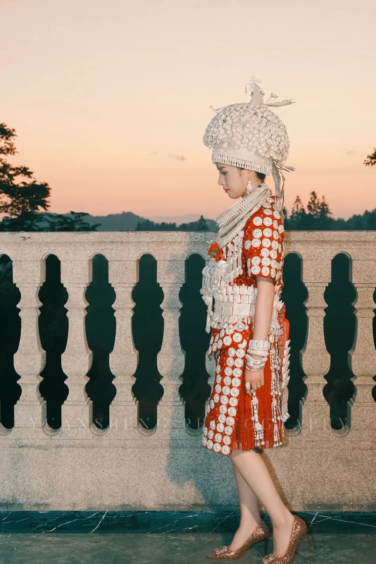 Huangping Miao traditional dress showing side profile sunset.