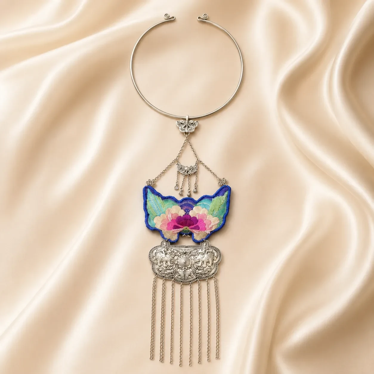 Layered metal ornament on a real embroidered necklace