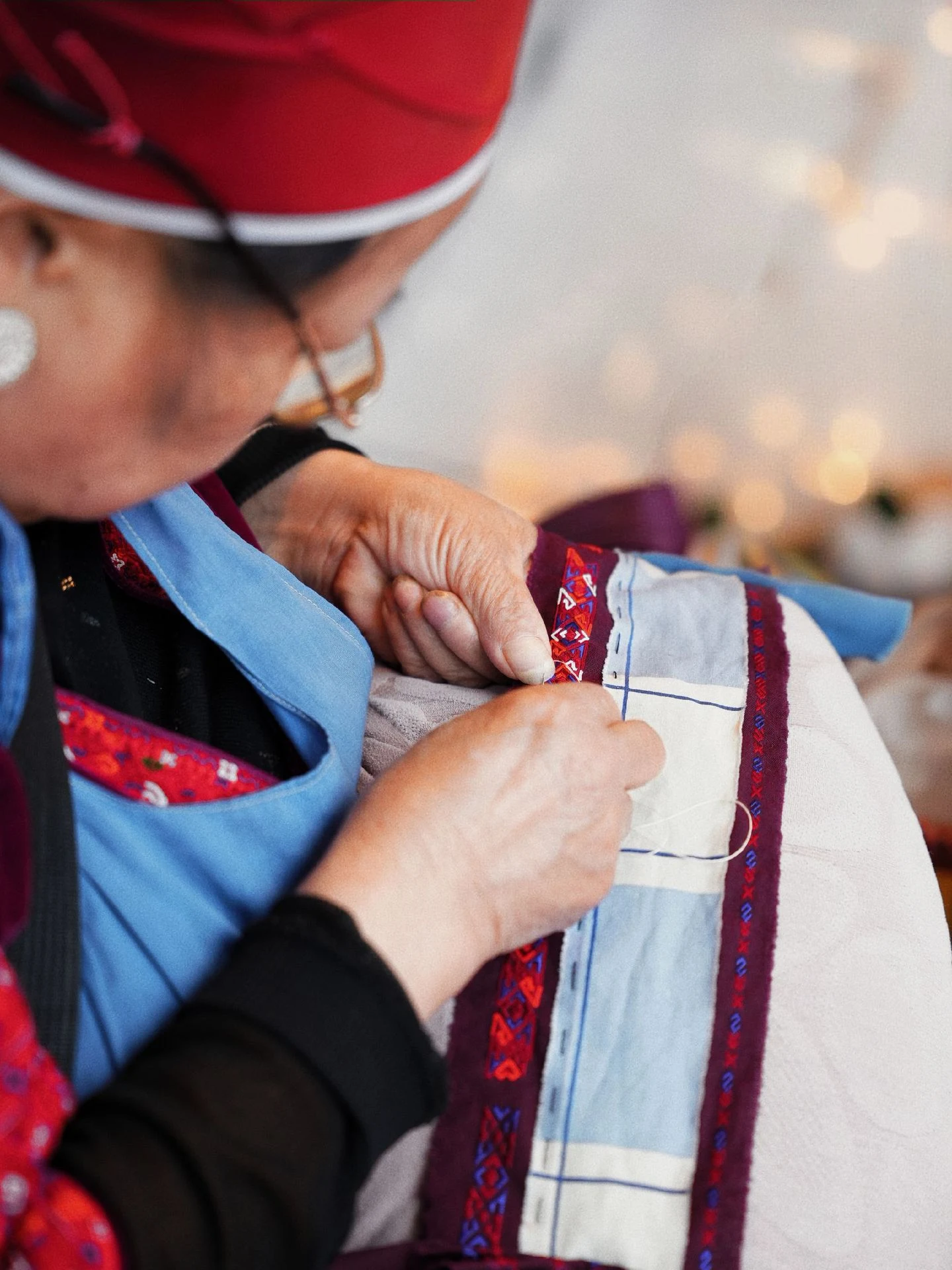 Close-up of hand embroidery process on Miao textile