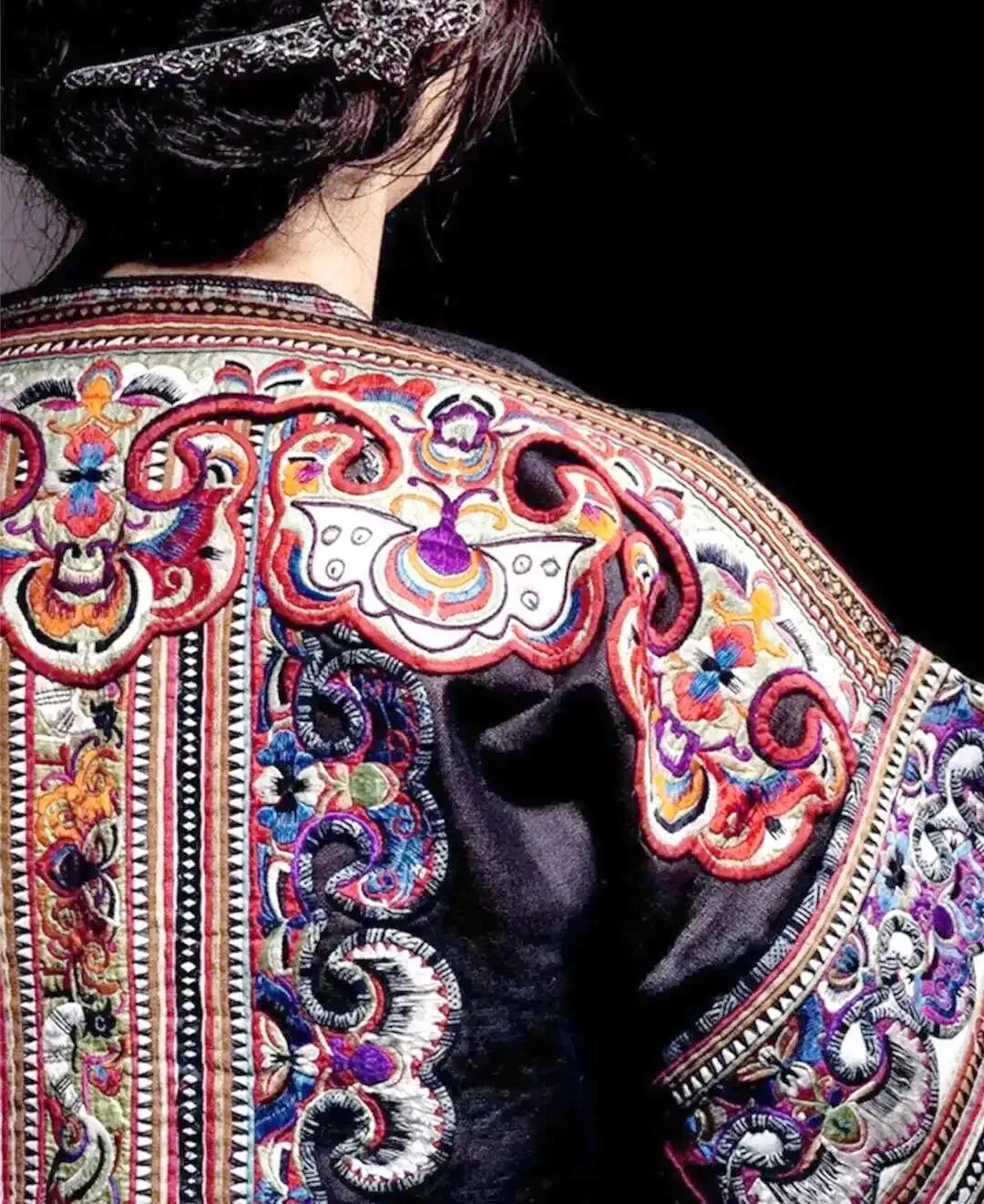 Miao embroidered clothing with butterfly pattern in cultural styling